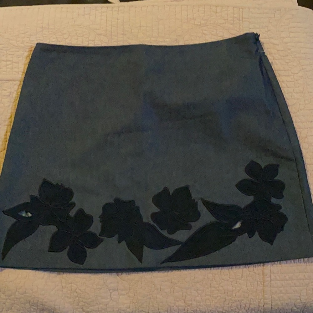 Unique Express skirt size 5/6; navy blue denim look cotton blend Floral appliqué